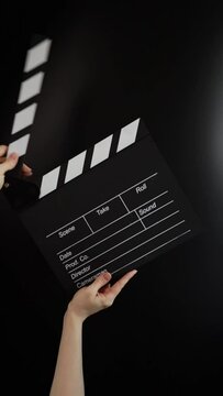Hands with clapboard, movie tickets sale, cinema discount, production.