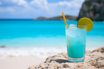Blue cocktail on a paradisiacal beach with turquoise waters
