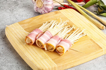 Raw Enoki mushroom with bacon