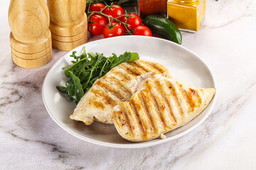 Grilled chicken breast served arugula