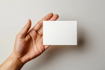 Fototapeta premium Blank White Card Mockup on Hand created with Generative AI