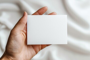 Obraz premium Blank White Card Mockup on Hand created with Generative AI