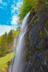 Fototapeta premium Wasserfall bei Seealp am Seealpsee im Alpsteingebirge, Kanton Appenzell Innerrhoden (Schweiz)