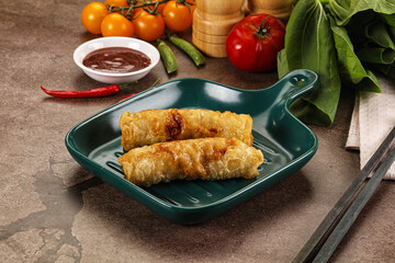 Vietnamese stuffed spring roll served sauce