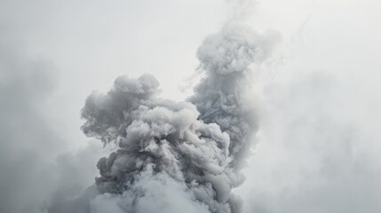 Light grey smoke resembling a silver mist against a background of winter haze