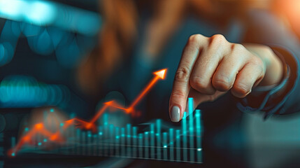 A businesswoman pointing her finger towards an arrow graph symbolizing business development towards success, profitability, and the execution of a growing growth plan