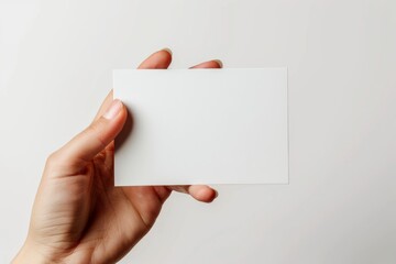 Obraz premium Blank White Card Mockup on Hand created with Generative AI