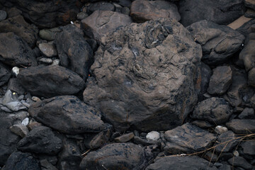 many dark rocks together