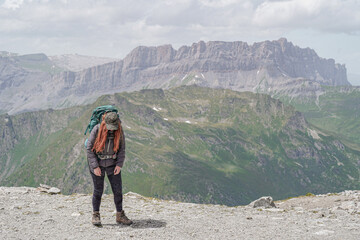 Fototapeta premium Woman hiking the tour du Mont Blanc in the beautiful mountains of France, Italy and Switzerland. Hiking the Alps. 