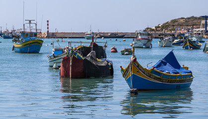 Boats into the harbour of Marsaxlokk, Malta island