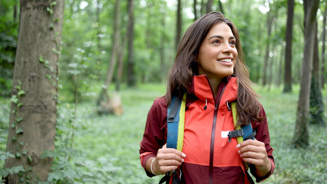 Beautiful, young woman hiking and enjoying in the nature