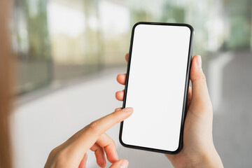 Hand holding smartphone mockup of blank screen, Take your screen to put on advertising.