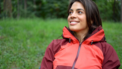Fototapeta premium Happy woman relaxing in the nature after hiking