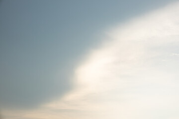 A cloudy sky with a white cloud in the middle