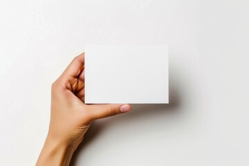 Obraz premium Blank White Card Mockup on Hand created with Generative AI