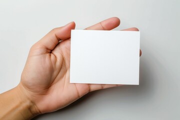 Obraz premium Blank White Card Mockup on Hand created with Generative AI