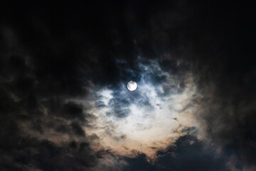 Full moon astral sky with colorful clouds