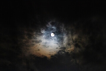 Full moon astral sky with colorful clouds