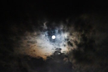 Full moon astral sky with colorful clouds