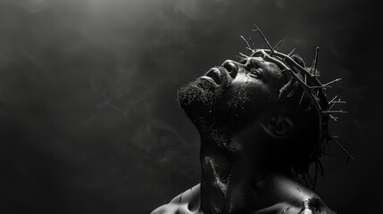 Dramatic portrait of black Jesus Christ with crown of thorns