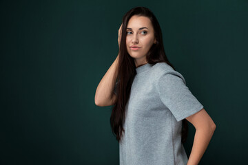 Woman Standing in Front of Green Background