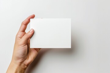 Obraz premium Blank White Card Mockup on Hand created with Generative AI