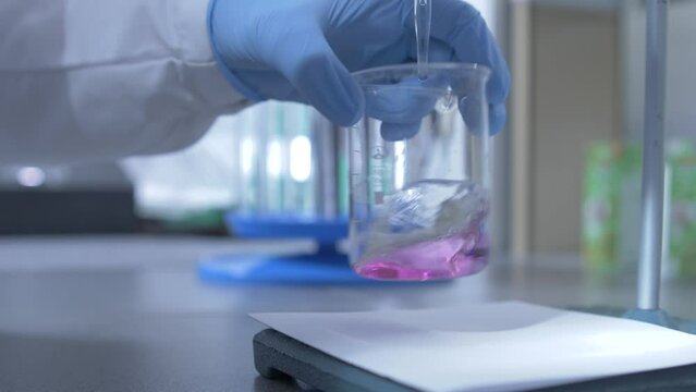 close-up process of analyzing the quality of water, liquid in a laboratory