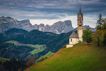 Fototapeta premium Chapel of St Barbara at dawn in Dolomites, Italy