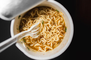 Cup of Instant Noodles with Fork