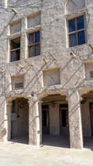 Street of Dubai old city or town or old village Al Seef Khor in Al Fahidi neighborhood, United Arab Emirates.  Vertical image