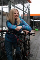 Nice young woman going for a bike ride in winter