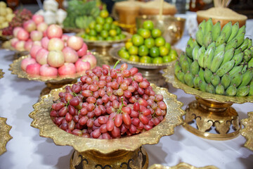 Fresh Fruits in Golden Trays on White Table