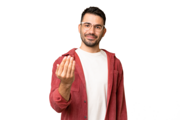 Young handsome caucasian man over isolated chroma key background inviting to come with hand. Happy that you came