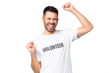 Young volunteer caucasian man over isolated chroma key background celebrating a victory