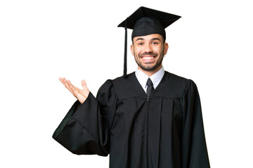 Young university graduate man over isolated chroma key background extending hands to the side for...