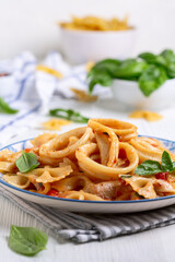 Pasta with calamari and tomato sauce.