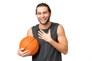 Young basketball player man over isolated background smiling a lot