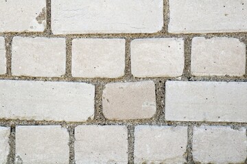 brick wall made of cement mortar and white bricks