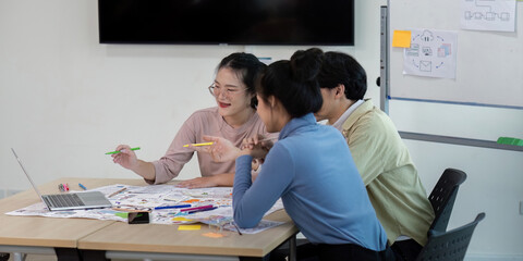 Creative UX Developer and UI Designer Team Brainstorming Ideas in Modern Office Setting with...