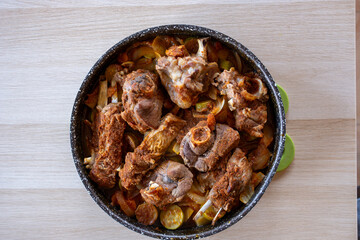 Meat vegetables tray  cooked in oven on wooden background  with mock up space