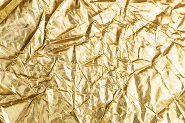 Gold crumpled paper for background wrinkled surface, design, wallpape