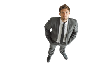 Businessman in a suit looking up, isolated on transparent background. top view, serious expression, professional attire.
