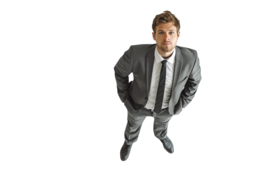 Businessman in a suit looking up, isolated on transparent background. top view, serious expression, professional attire.