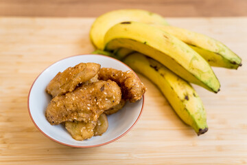 Crispy fried bananas in the small white bowl