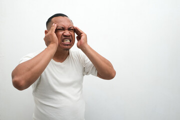 Naklejka premium asian man feeling headache isolated on white background