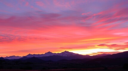 Fototapeta premium Delicate shades of pink and orange dance in the background as the dawn sky slowly unfolds. .