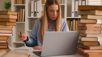 Stressed busy annoyed Caucasian student girl high school pupil woman stressful leaner studying with...