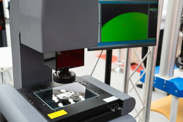 Optic machine for precise measurement of part size and quality evaluation. Smart factory..