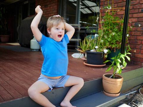 Blonde Boy Exclaims with Delight