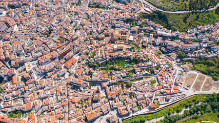 Obraz premium Aerial photo from drone to city of Loja and Church of the Incarnation with Moorish Alcazaba and Gorda Peak .Loja ,Granada, Andalusia, Spain, Europe (Series)